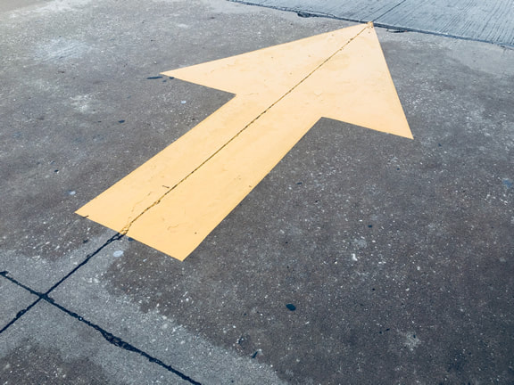 Directional arrow painted on your parking lot in Tyler, Texas